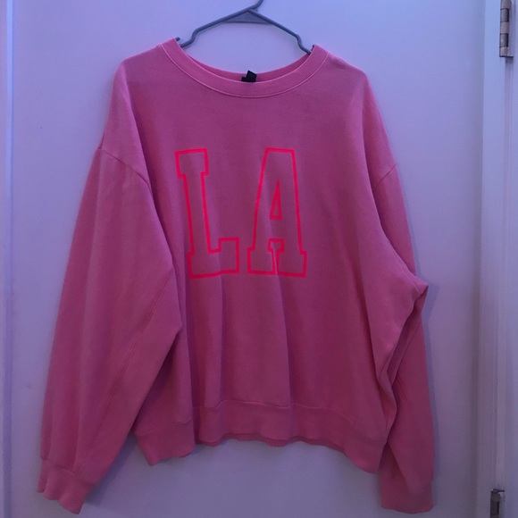 Pink L.A. sweatshirt.